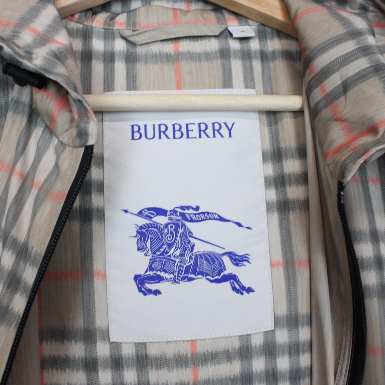 Burberry beige windbreaker jacket with Nova Check pattern and full zip hood.
