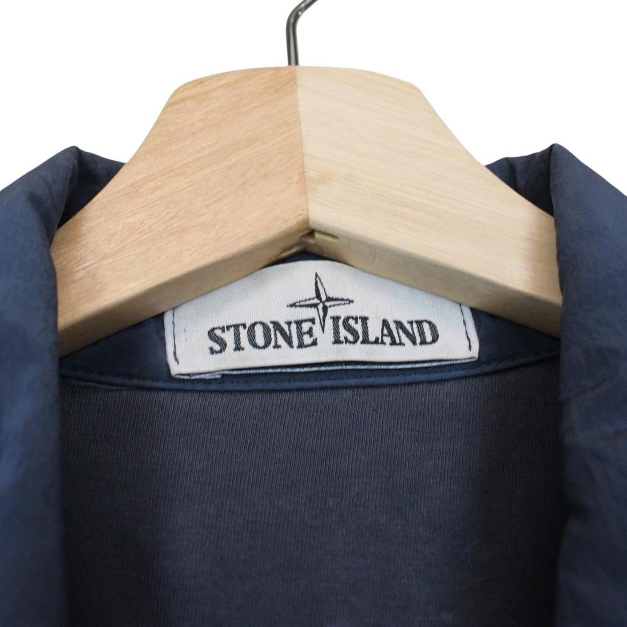 Stone Island navy blue full zip nylon overshirt with logo patch and metal finish.
