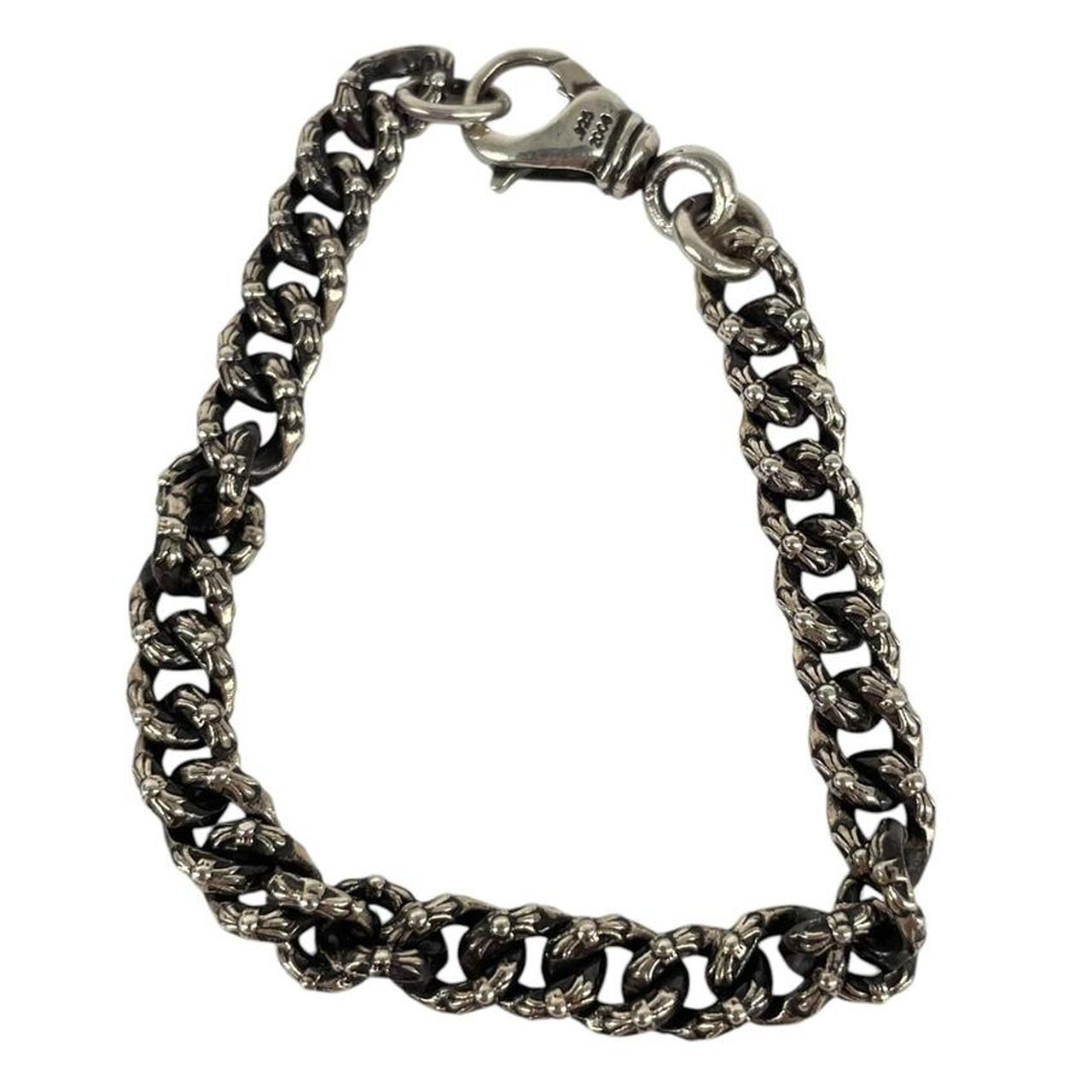Chrome Hearts silver bracelet with intricate link design and logo detailing.