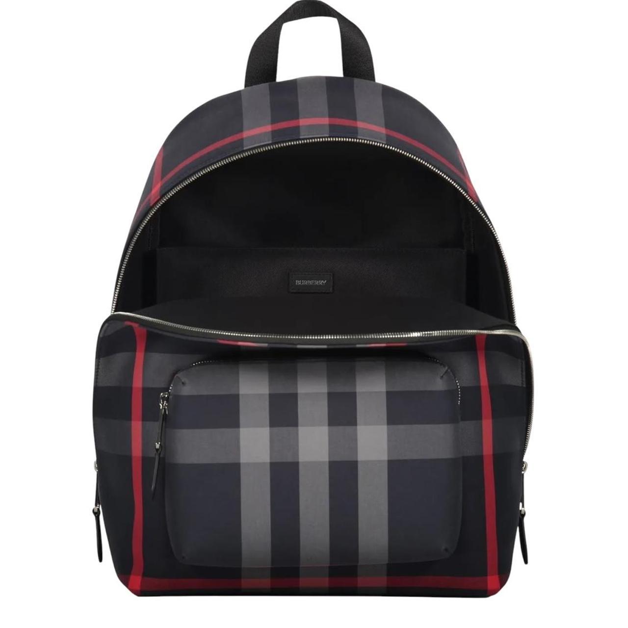 Burberry duffel bag navy blue and black signature Nova Check pattern with logo.