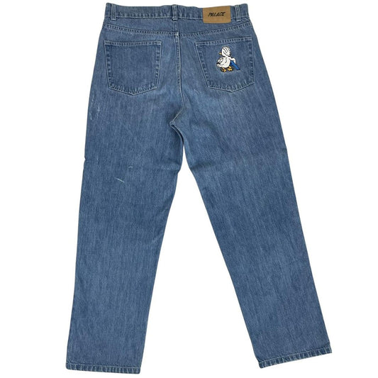 Palace blue straight jeans with mid stone wash and quacked pattern details.