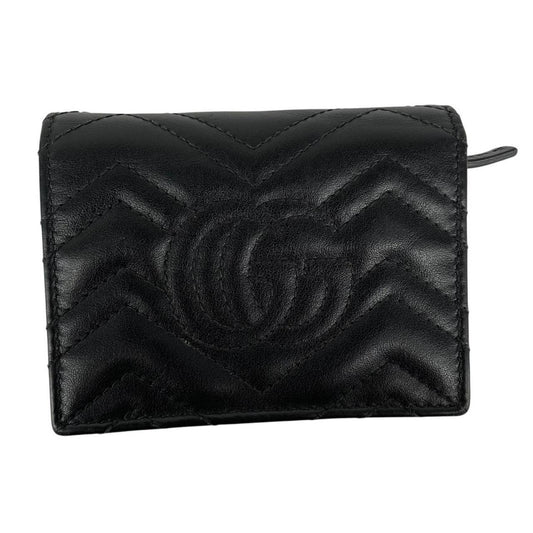 Gucci black calfskin card case wallet with matelasse pattern and GG logo.