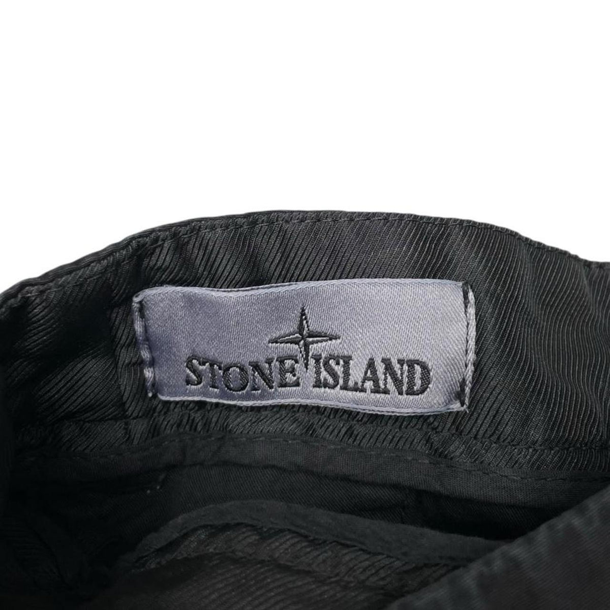 Stone Island black cargo shorts with logo patch and cotton material.