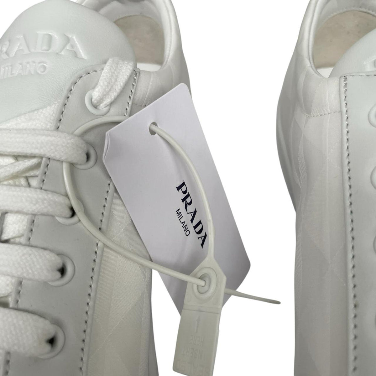 Prada white trainers Re-Nylon and brushed leather with logo detail and dust bags.