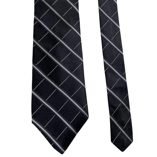 DKNY black silk tie with vintage striped pattern and logo detail.