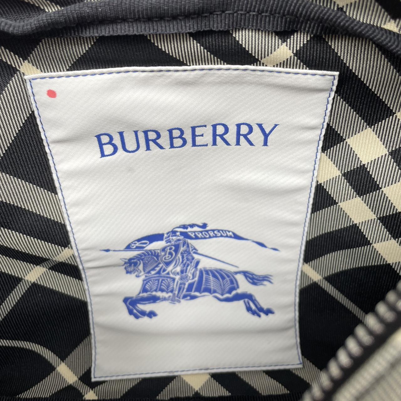 Burberry black and white EKD check canvas duffel bag with logo detail.