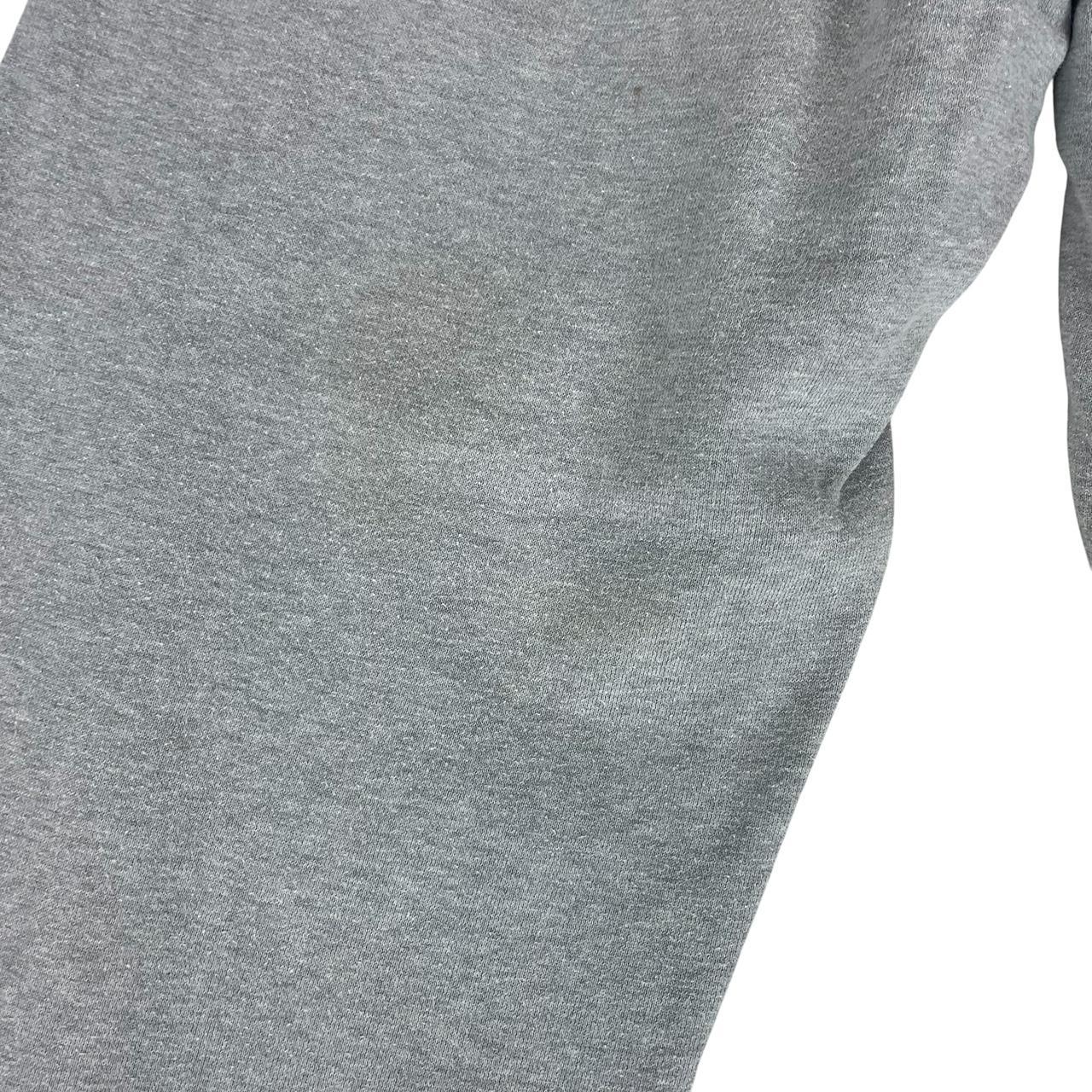 Stone Island grey tracksuit bottoms cotton material with logo patch and faint marks.