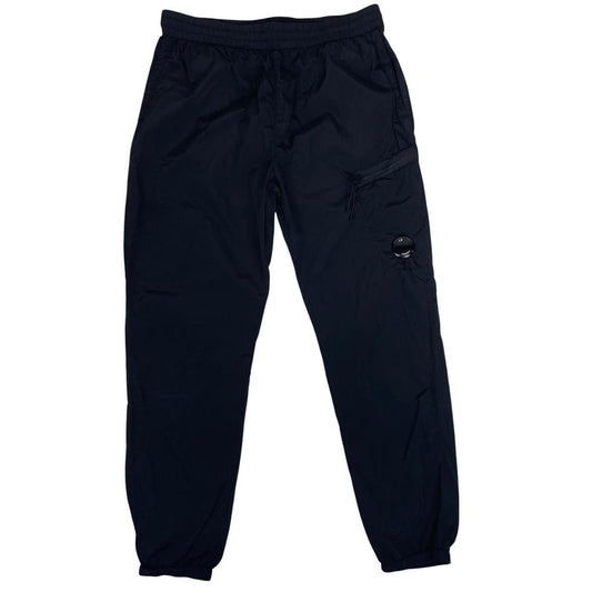 CP Company black cargo trousers with lens detail and nylon material.