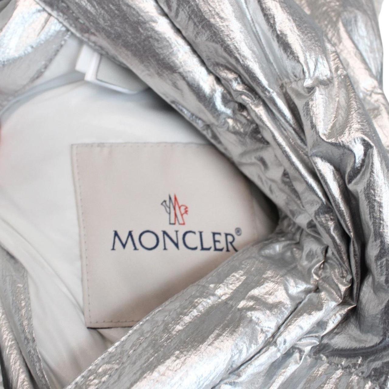 Moncler white and silver reversible down jacket with full zip and hood.