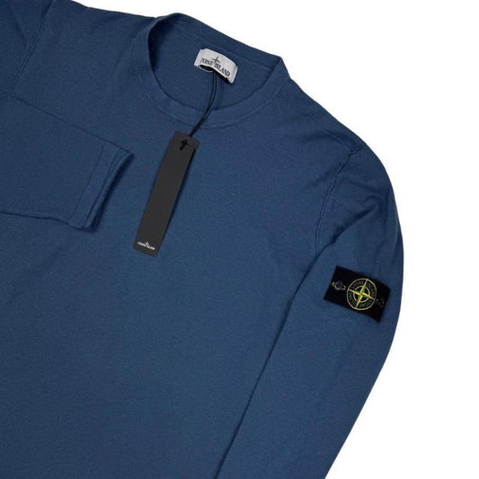 Stone Island blue organic cotton knit jumper with logo patch and ribbed detailing.
