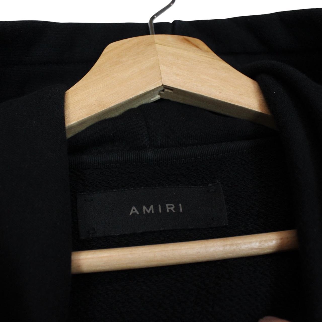 AMIRI black hoodie with rhinestone embellishments and crystal stick poke details.