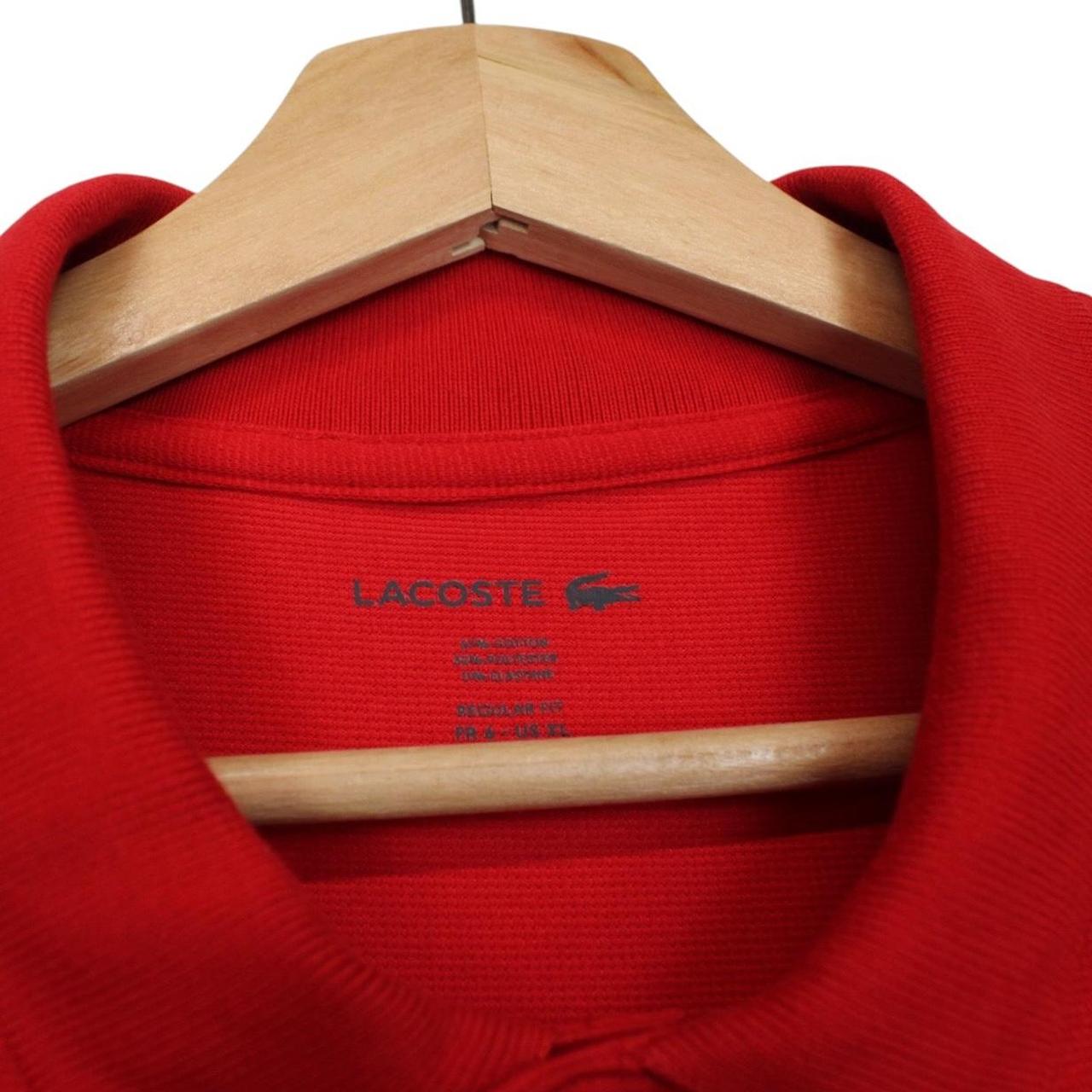 Lacoste red short sleeve polo shirt with embroidered crocodile logo, cotton material.