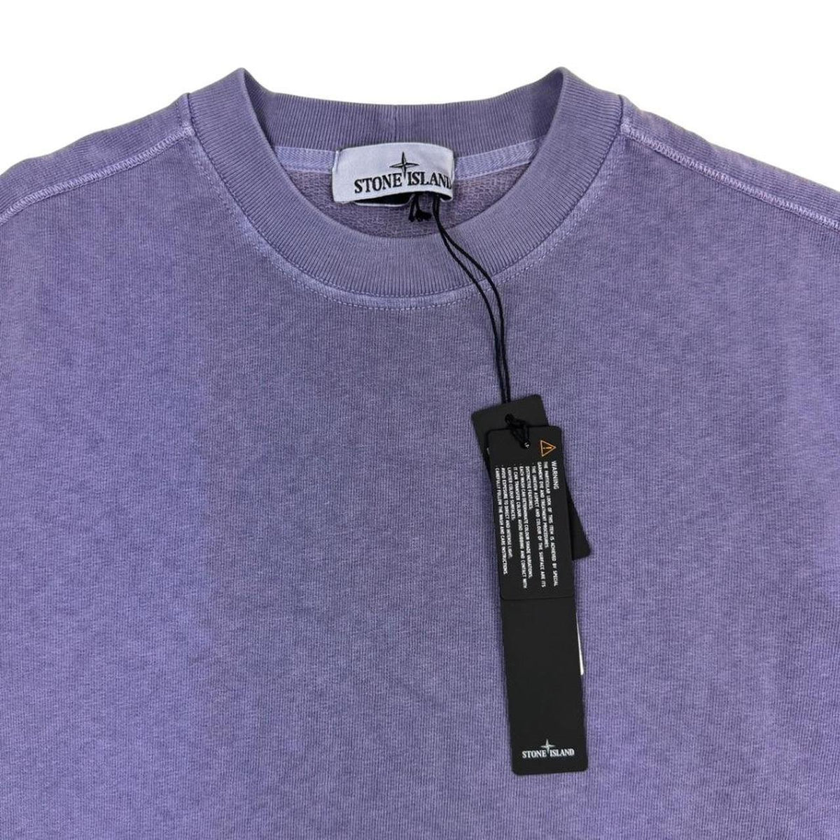 Stone Island purple cotton sweatshirt with logo patch and garment dyed finish.