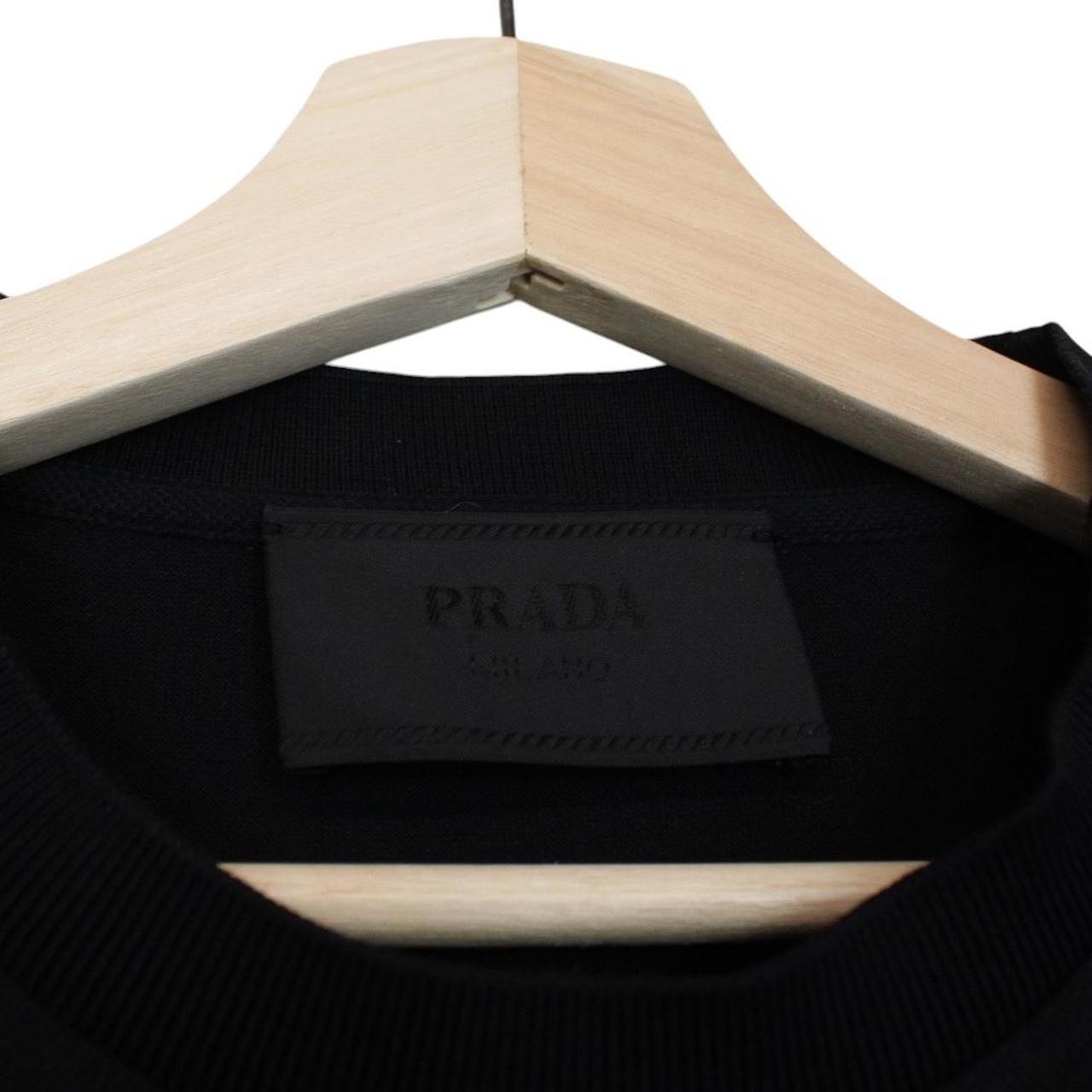 Prada black and white cotton short sleeve t-shirt with logo pocket detail.