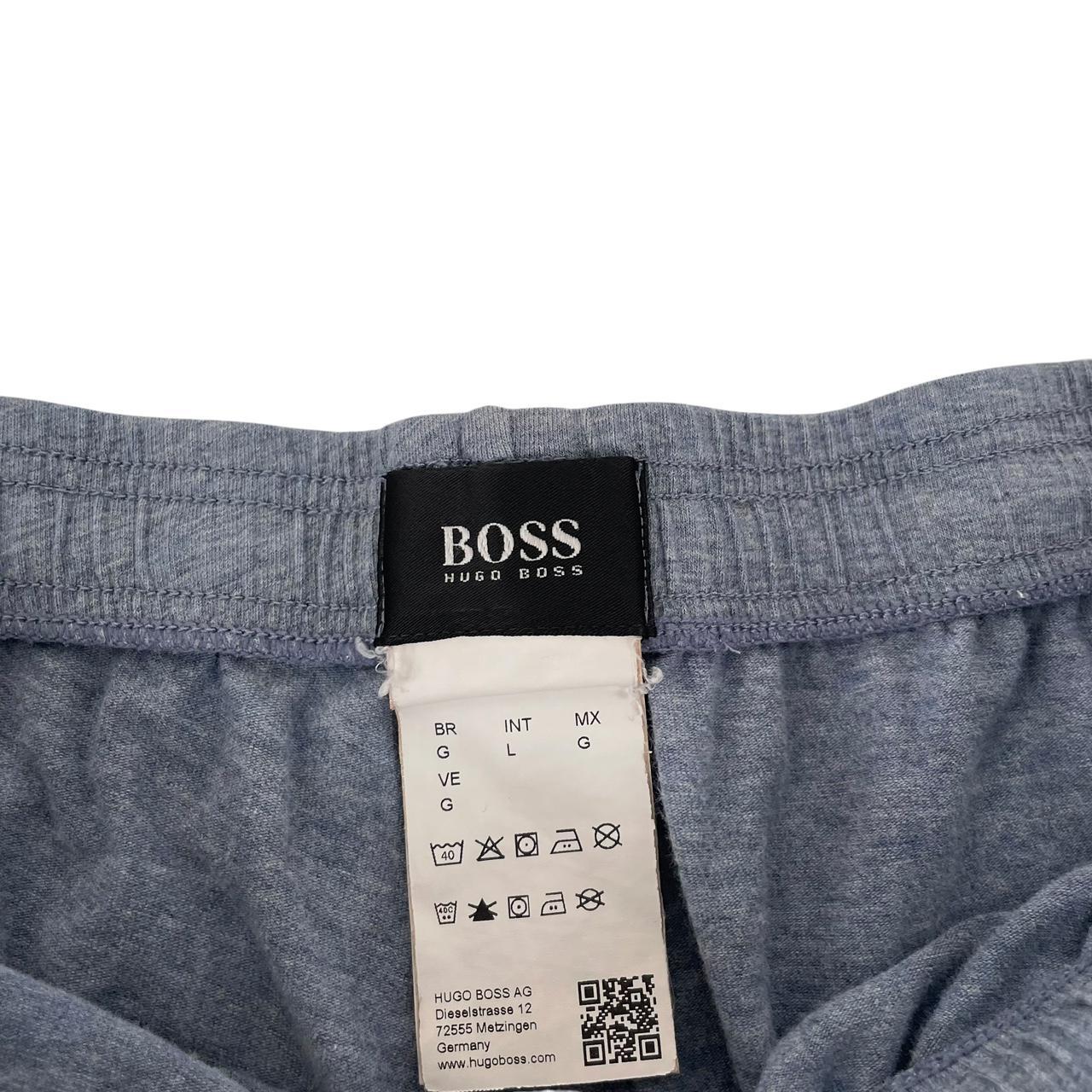 Hugo Boss blue jogger shorts with elastic waistband and logo detail.