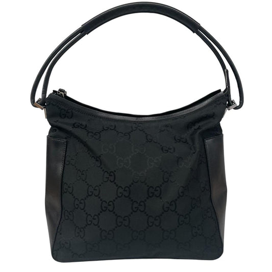 Gucci black hobo shoulder bag with monogram canvas and leather detailing.