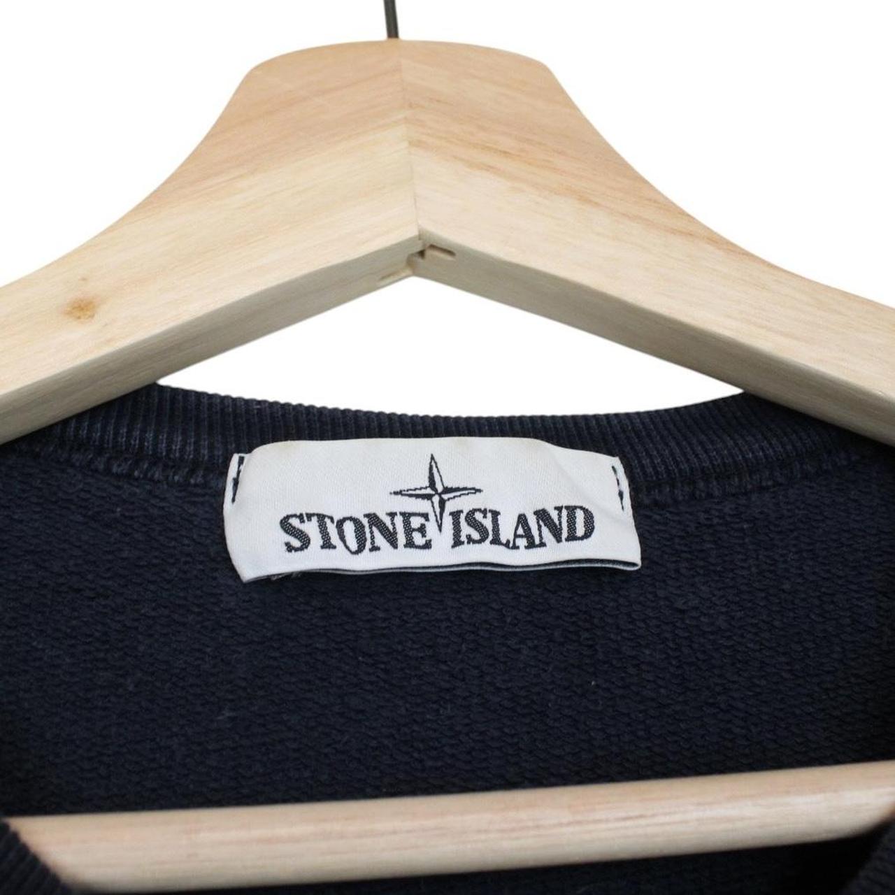 Stone Island navy blue cotton sweatshirt with iconic compass logo and ribbed cuffs.
