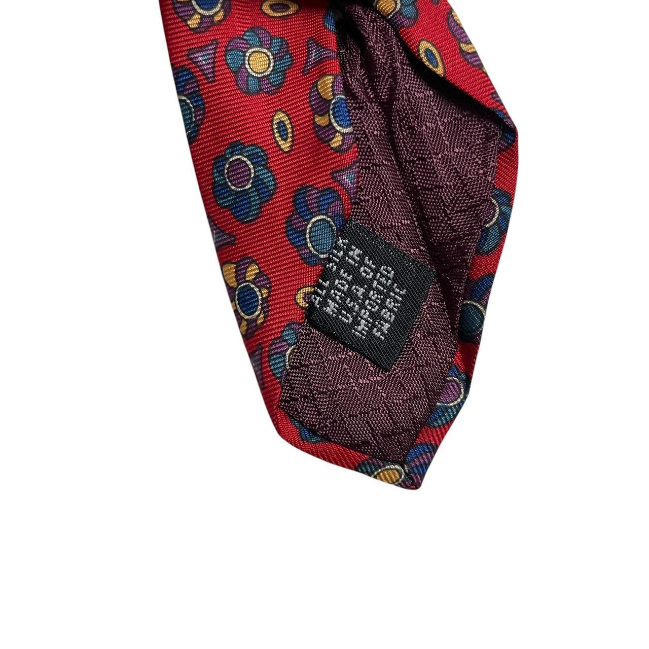Christian Dior multicoloured silk tie featuring intricate patterns and luxurious sheen.