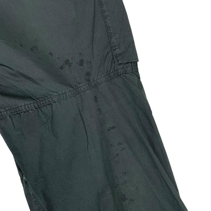 Stone Island grey cargo trousers with logo patch and loose stitch detail.