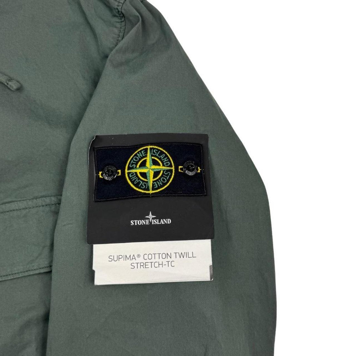 Stone Island green hooded jacket with full zip, Supima cotton twill material, logo patch.