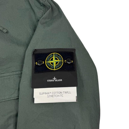 Stone Island green hooded jacket with full zip, Supima cotton twill material, logo patch.