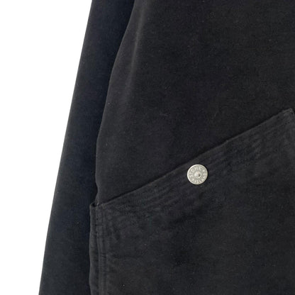 Stone Island navy blue work jacket with detachable compass badge and button-down closure.