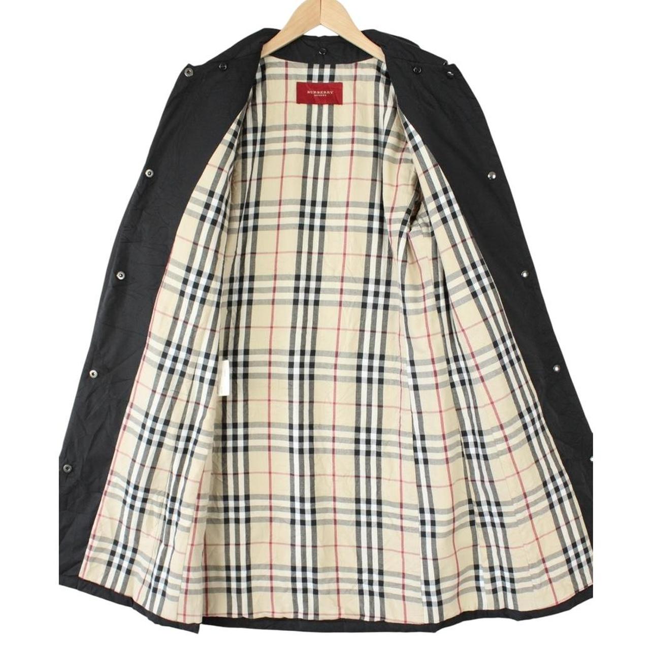 Burberry black trench coat featuring Nova Check pattern and quilted fabric.