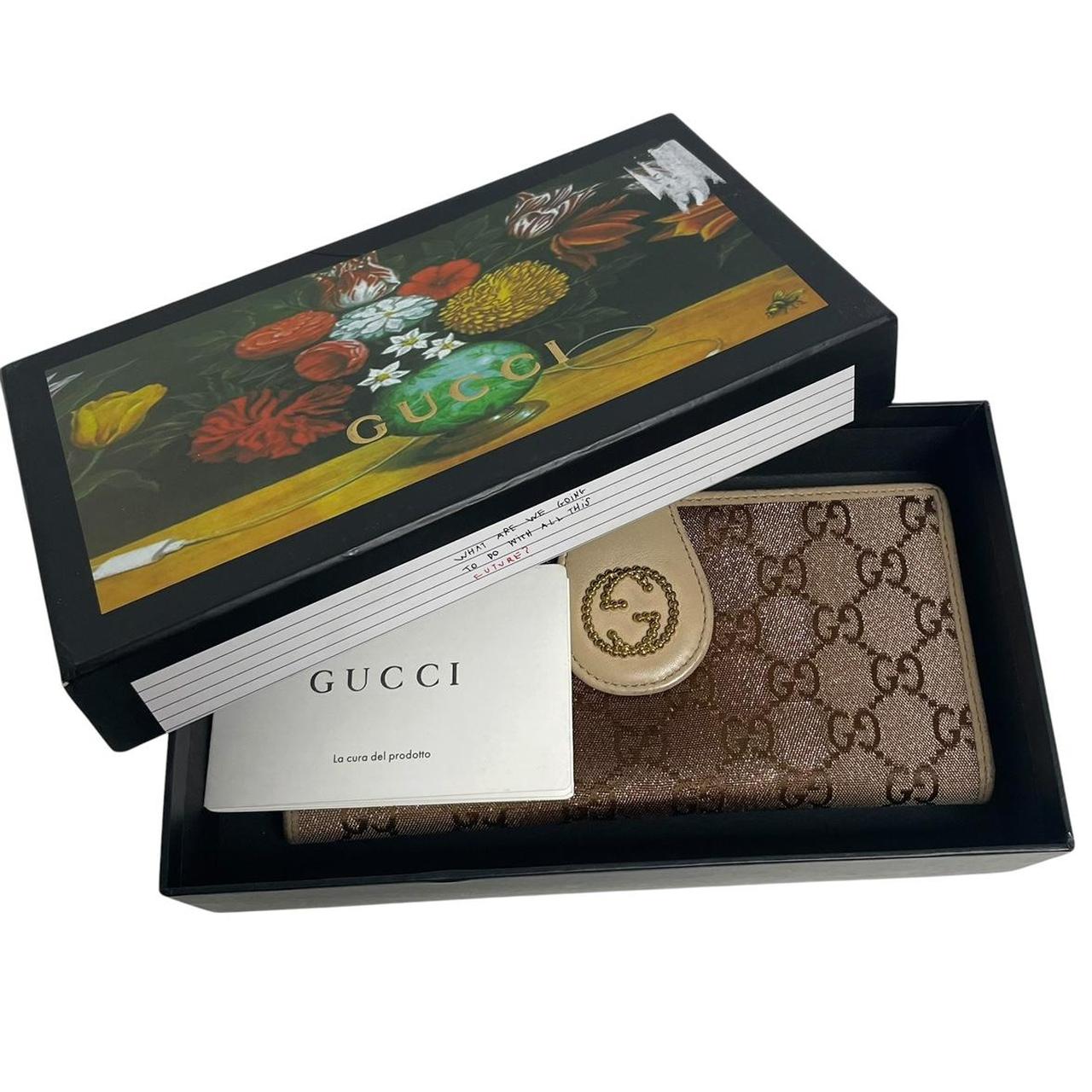 Gucci beige and pink GG monogram continental wallet with logo and wear details.