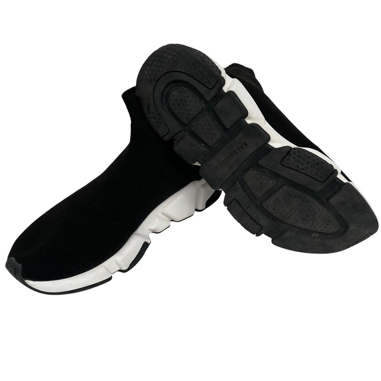 Balenciaga Speed 2 black and white trainers with logo detailing and cotton material.
