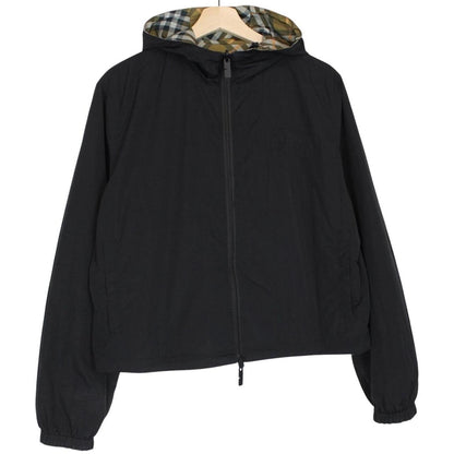 Burberry reversible nylon jacket in brown and black Nova Check pattern with logo.