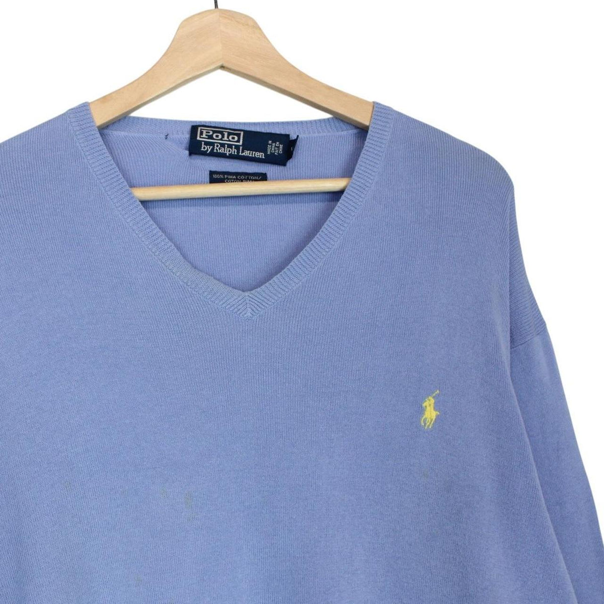 Polo Ralph Lauren blue knit v-neck jumper, soft pima cotton, faint marks visible.