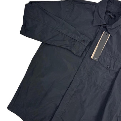 Stone Island black nylon overshirt jacket with ghost logo and smooth texture.