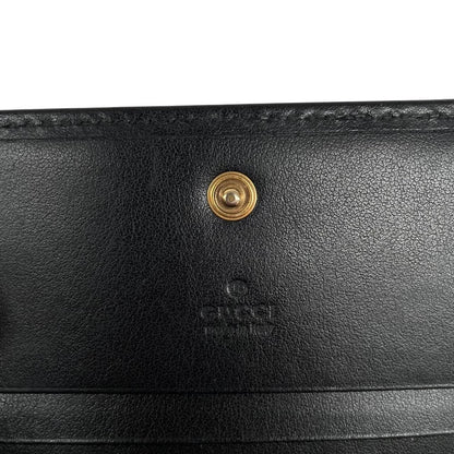 Gucci black calfskin card case wallet with matelasse pattern and GG logo.