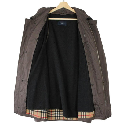 Burberry brown quilted coat featuring iconic Nova Check pattern and removable wool lining.
