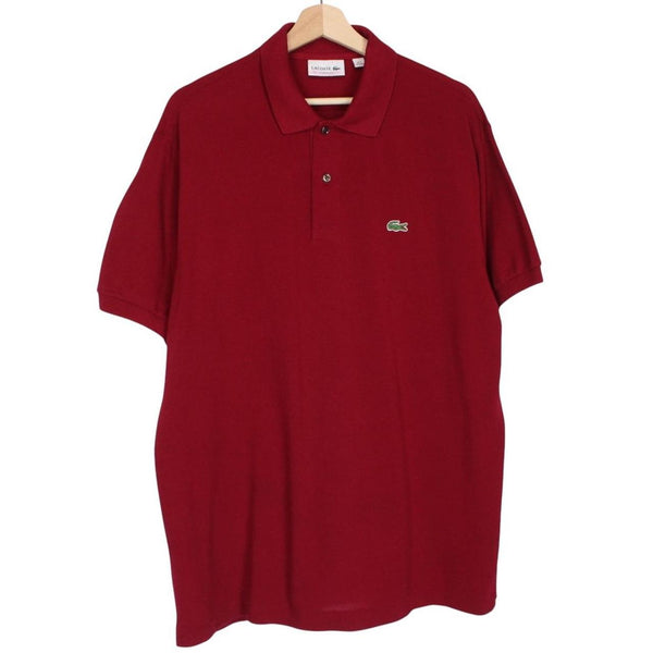 Lacoste burgundy polo shirt with embroidered crocodile logo and pocket detail.