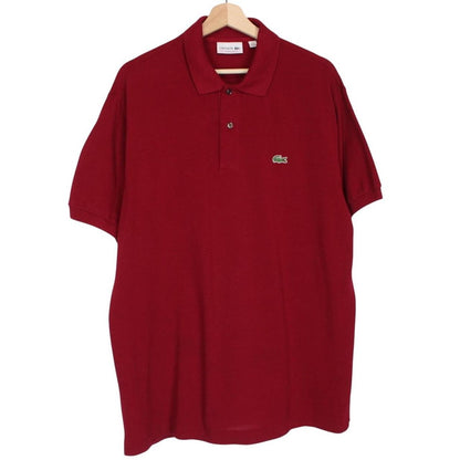 Lacoste burgundy polo shirt with embroidered crocodile logo and pocket detail.