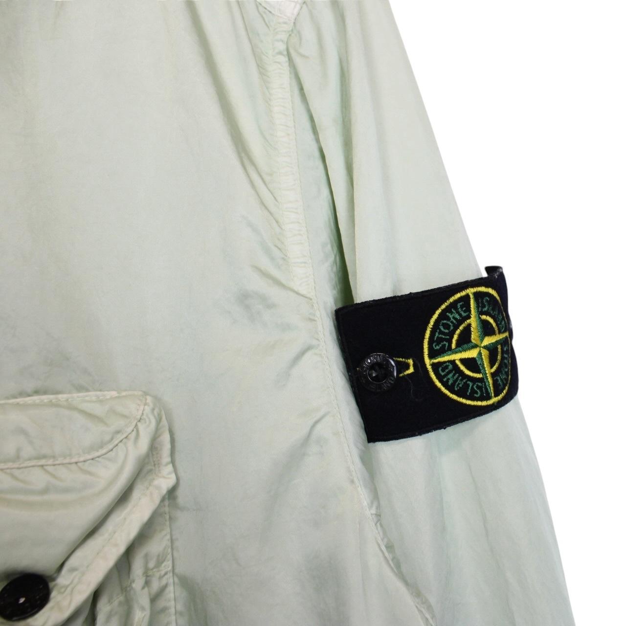 Stone Island mint green multi pocket jacket with logo patch and nylon material.