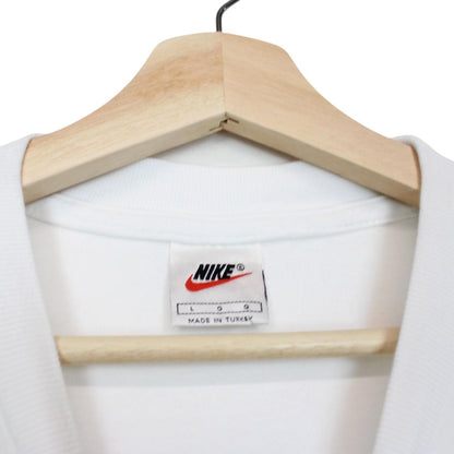 Nike white short sleeve cotton t-shirt with pocket and vintage logo detail.