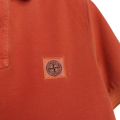 Stone Island orange short sleeve polo shirt with compass logo and cotton material.