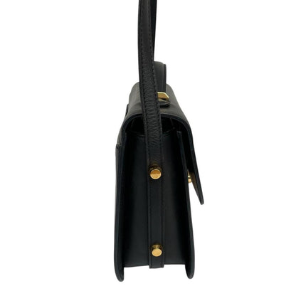 Alexander McQueen black and gold leather messenger bag with logo detailing and faint scratches.
