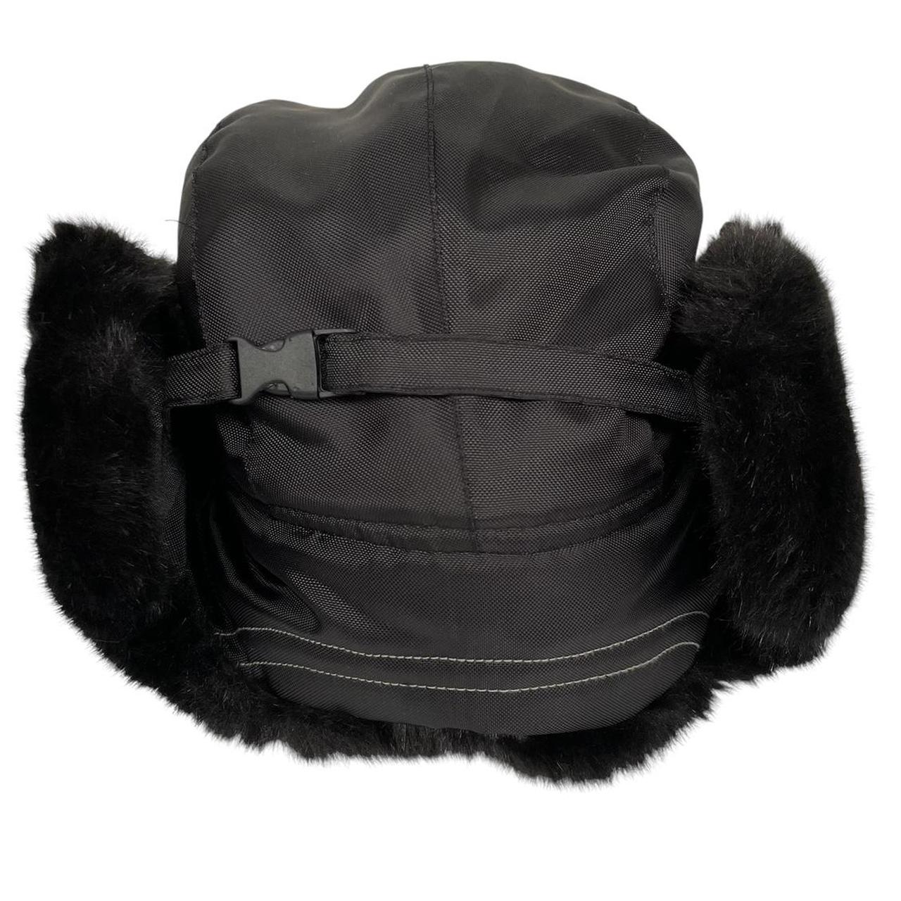 Paul Smith black nylon trapper hat with tags, featuring classic design and logo details.