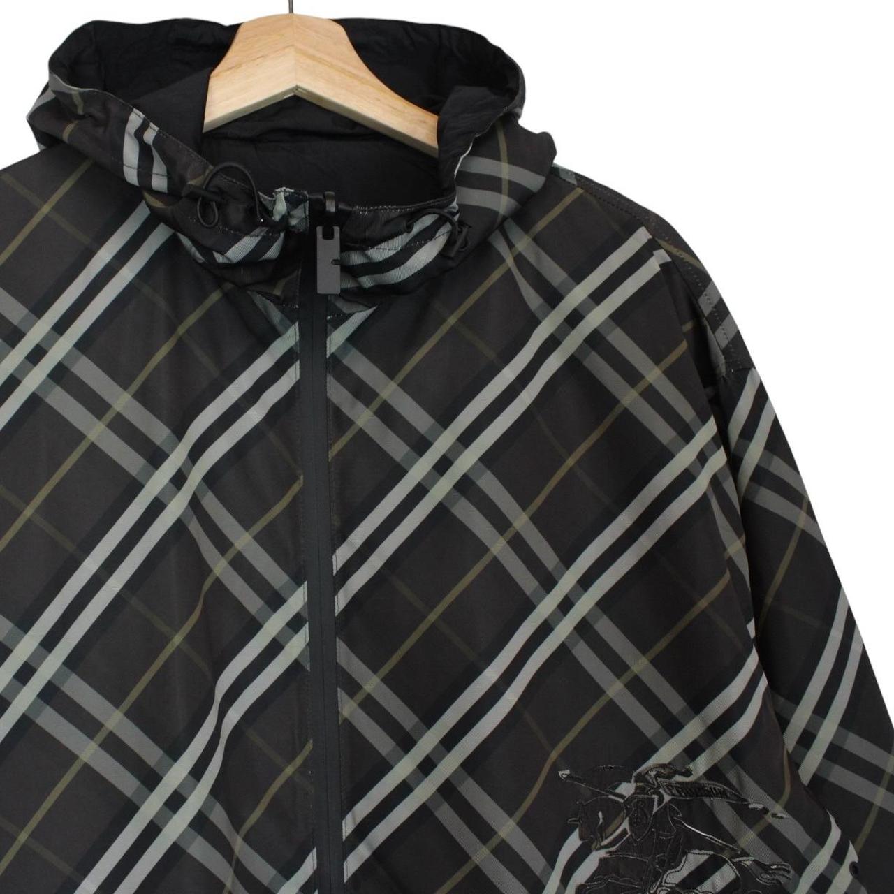 Burberry reversible jacket in dark grey and black with Nova Check pattern and full zip.