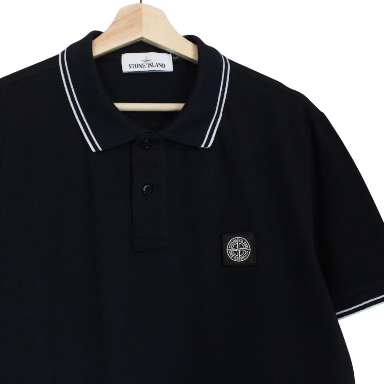 Stone Island navy blue short sleeve polo shirt with compass logo and cotton material.