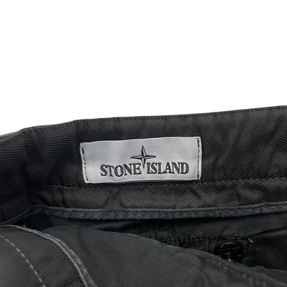 Stone Island black skinny fit cargo trousers with logo patch and multiple pockets.