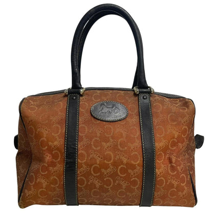 CELINE orange duffel bag with Macadam canvas and leather, visible wear and discolouration.