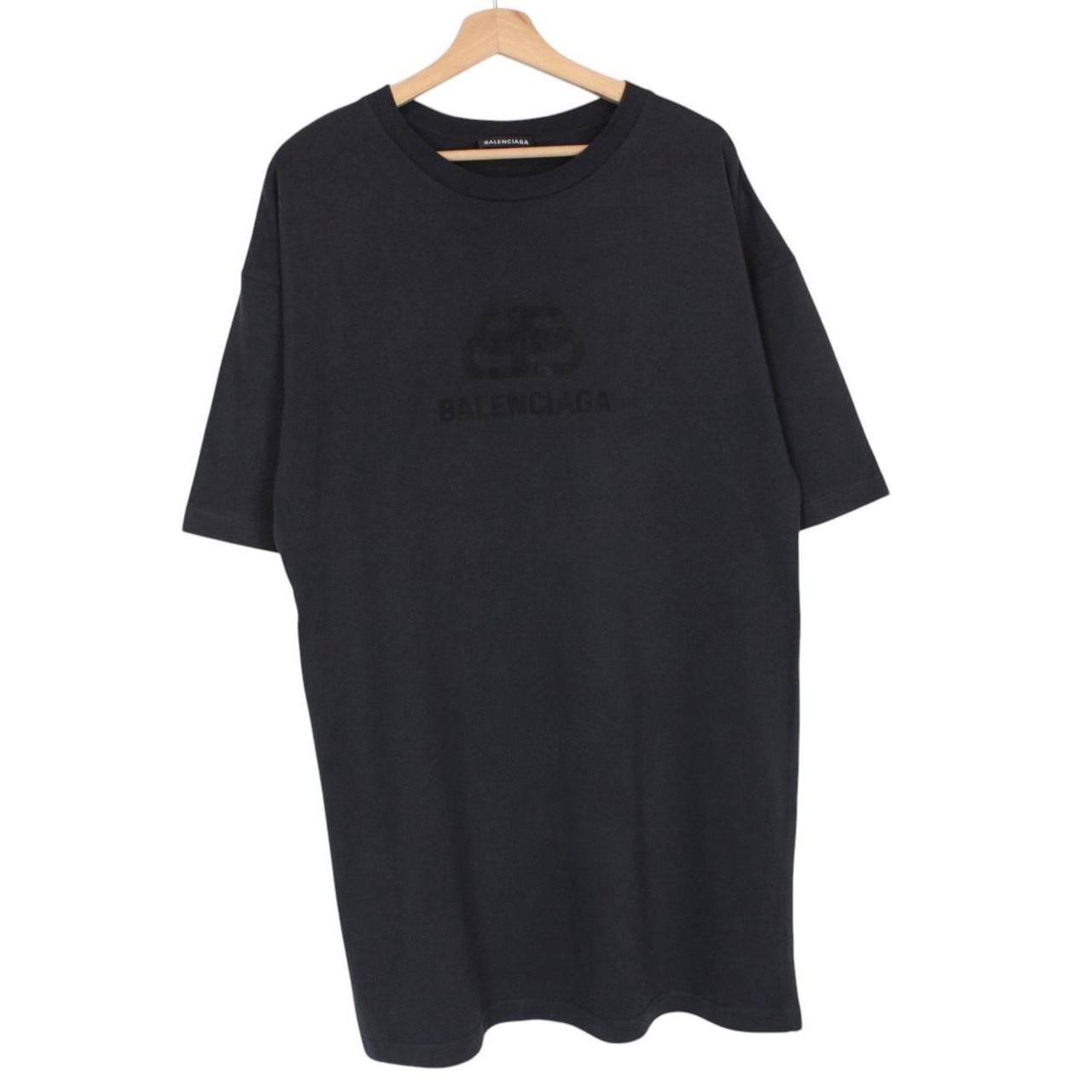 Balenciaga black oversized pocket t-shirt with bold logo print on front.