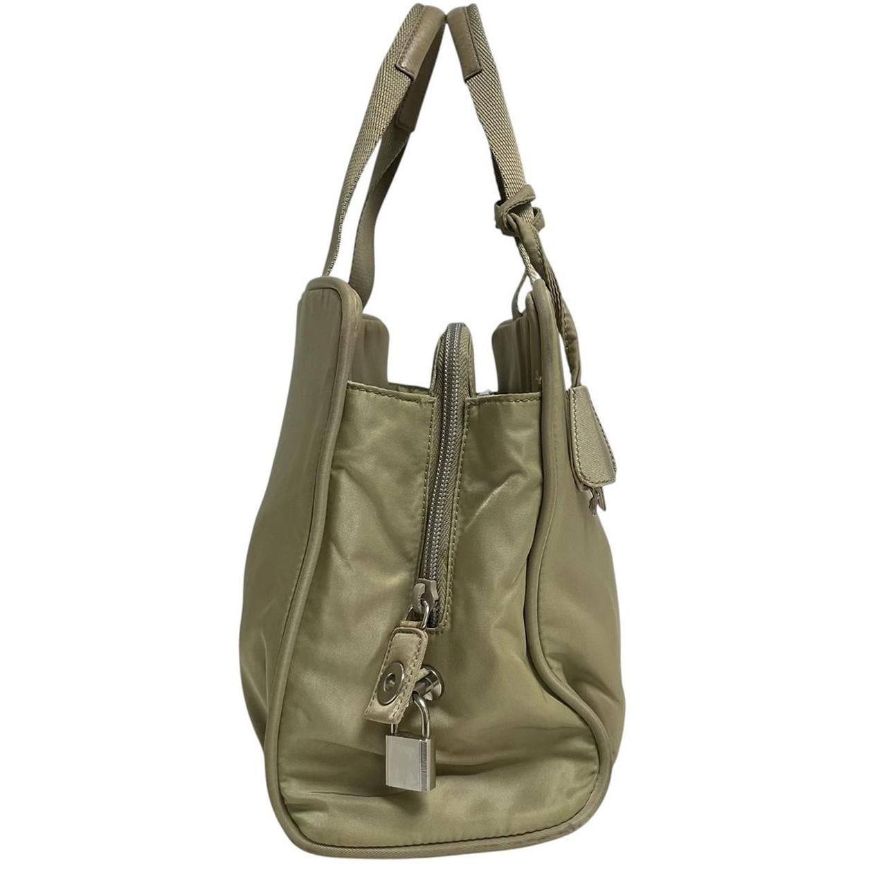 Prada green nylon duffel bag with logo detail and working lock and key.