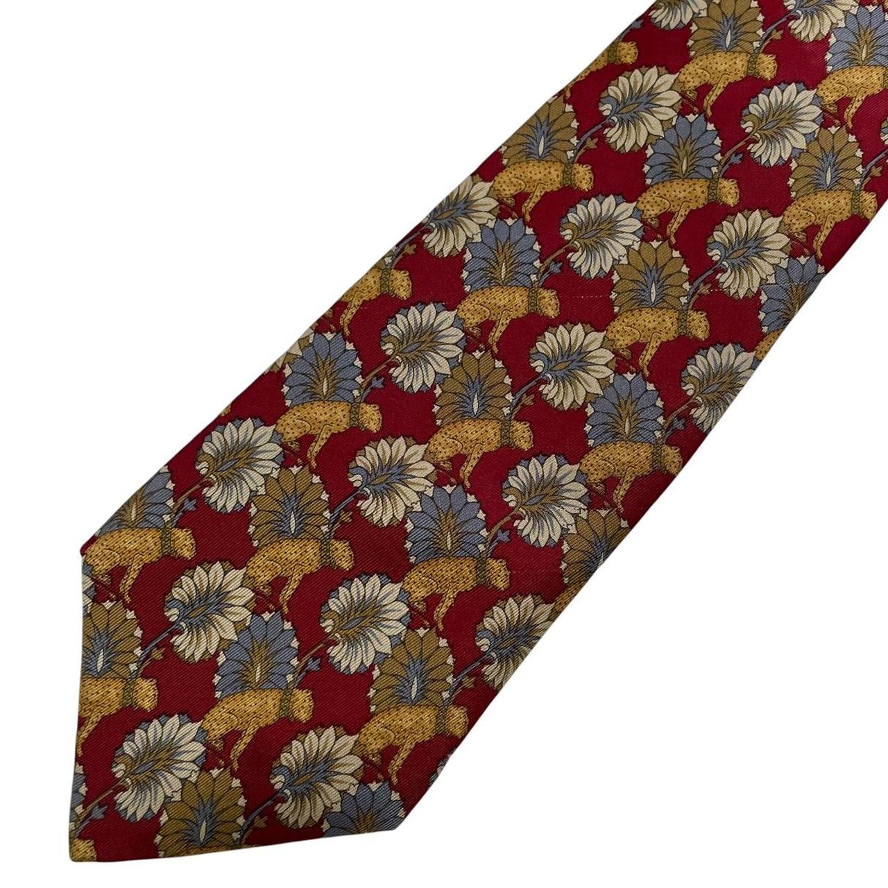 Christian Dior multicoloured silk tie featuring leopard print pattern and logo detail.