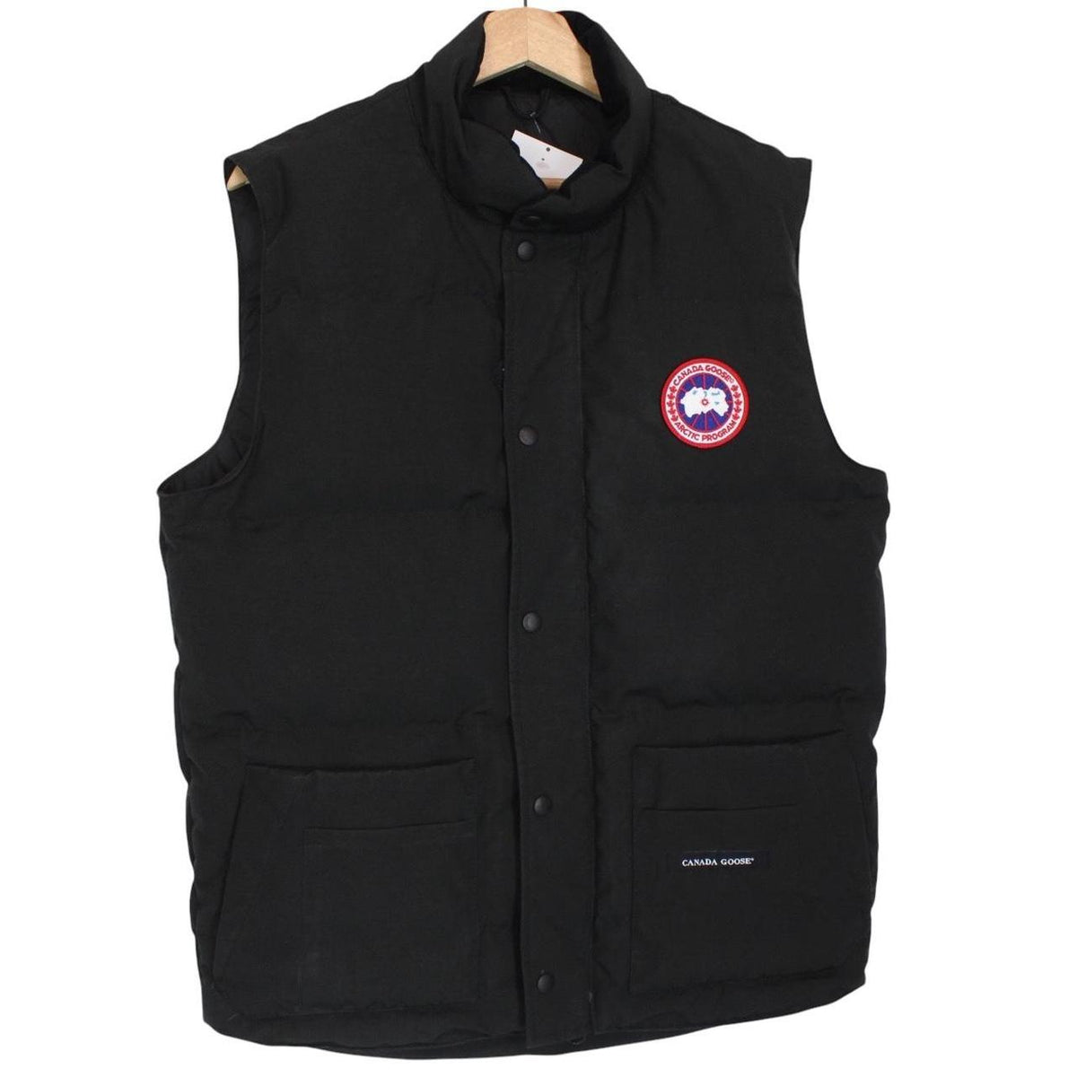 Canada Goose black down gilet with logo patch and zippered pockets.