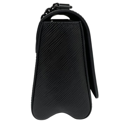 Louis Vuitton black Epi leather duffel bag with twist lock and visible wear.